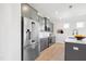 Modern kitchen with stainless steel appliances and gray cabinets at 52 Commons Cir, Clayton, NC 27520