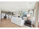 Open-concept living space with hardwood floors, modern fireplace, and view of the kitchen at 52 Commons Cir, Clayton, NC 27520