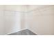 Empty walk-in closet with wire shelving and carpet at 52 Commons Cir, Clayton, NC 27520