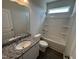 Bathroom featuring a shower-tub combo, granite vanity, and modern fixtures at 52 Commons Cir, Clayton, NC 27520