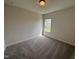 Bedroom with carpet, neutral walls, a ceiling light, and window at 52 Commons Cir, Clayton, NC 27520