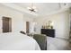 Bright bedroom featuring a tray ceiling, walk-in closet, and modern furniture at 52 Commons Cir, Clayton, NC 27520