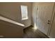 Bright entryway with wood flooring, and natural light from a window near the front door at 52 Commons Cir, Clayton, NC 27520