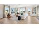 Bright living room with a fireplace, large windows, and modern decor at 52 Commons Cir, Clayton, NC 27520