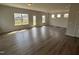 Bright living area with hardwood floors, neutral walls, and multiple windows for abundant natural light at 52 Commons Cir, Clayton, NC 27520