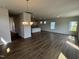 Hardwood floors throughout the open living space, connecting the dining area with a kitchen island at 52 Commons Cir, Clayton, NC 27520