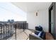 Outdoor patio featuring modern furniture on wooden deck overlooking a city view at 523 S West St # 409, Raleigh, NC 27601