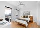 Inviting bedroom with large windows, a ceiling fan, and a view of the city skyline at 523 S West St # 409, Raleigh, NC 27601