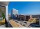 Urban balcony view overlooking a city street with cars and modern buildings under a clear blue sky at 523 S West St # 409, Raleigh, NC 27601