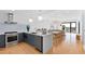 Modern kitchen flows into open-concept dining and living area with light and airy design at 523 S West St # 409, Raleigh, NC 27601