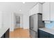 Kitchen with stainless steel appliances and view to bathroom at 523 S West St # 409, Raleigh, NC 27601