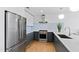 A view of a modern kitchen featuring stainless steel appliances, light countertops and a gas range at 523 S West St # 409, Raleigh, NC 27601