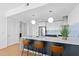 Modern kitchen with a stylish island, stainless steel appliances, and chic pendant lighting at 523 S West St # 409, Raleigh, NC 27601