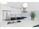 Bright kitchen featuring stainless steel appliances, light countertops and a tiled backsplash at 523 S West St # 409, Raleigh, NC 27601