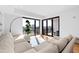 Sunlit living room with a large sectional sofa, city views, and a bright, airy feel at 523 S West St # 409, Raleigh, NC 27601
