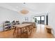Open-concept living space with hardwood floors, dining table, and living room with plenty of natural light at 523 S West St # 409, Raleigh, NC 27601
