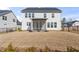 A view of the backyard showing a patio with screen, landscaped plantings, and fence at 652 Marion Hills Way, Knightdale, NC 27545