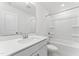 White bathroom featuring a single sink vanity, toilet, and a shower-tub combo at 652 Marion Hills Way, Knightdale, NC 27545
