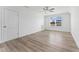 Bright bedroom with hardwood floors, ceiling fan, and natural light from the window at 652 Marion Hills Way, Knightdale, NC 27545