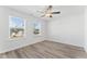 Bright bedroom with hardwood floors, a ceiling fan, and ample natural light at 652 Marion Hills Way, Knightdale, NC 27545