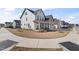 Well-manicured front yard of this two-story home featuring a charming front porch and tidy landscaping at 652 Marion Hills Way, Knightdale, NC 27545