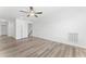 A light-filled living room with hardwood floors and recessed lighting, showing a staircase at 652 Marion Hills Way, Knightdale, NC 27545