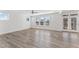 An open living area features wood floors, natural light, and easy access to an outdoor patio at 652 Marion Hills Way, Knightdale, NC 27545