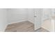 Spacious walk-in closet featuring wood-look floors and wire shelving for optimal storage at 652 Marion Hills Way, Knightdale, NC 27545