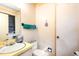 Bathroom featuring a sink, toilet, and a mirror; needs renovation at 722 Forge Rd, Durham, NC 27713