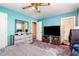 Bedroom with a ceiling fan, dresser, and mirror, offering ample space and natural light at 722 Forge Rd, Durham, NC 27713