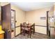 A cozy dining area with seating for four and seamless access to both the kitchen and the living room at 722 Forge Rd, Durham, NC 27713