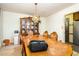Formal dining room with chandelier, wood table, wood chairs, and china cabinet at 722 Forge Rd, Durham, NC 27713