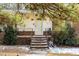 Charming home featuring a welcoming front door with decorative accents and a brick entryway with light snow at 722 Forge Rd, Durham, NC 27713