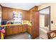 Another view of the kitchen showcasing its functional layout and access to dining area at 722 Forge Rd, Durham, NC 27713