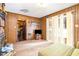 Comfortable living room with brick fireplace, wood paneling, and sliding glass doors to the outside at 722 Forge Rd, Durham, NC 27713