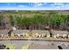 Scenic aerial view of townhomes backing up to wooded area and beautiful landscape at 736 Wickham Ridge Rd, Apex, NC 27539