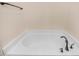 Modern bath with a white oval soaking tub at 736 Wickham Ridge Rd, Apex, NC 27539