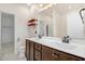 Bathroom featuring a double vanity with dark cabinets and neutral walls at 736 Wickham Ridge Rd, Apex, NC 27539