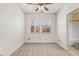 Neutral bedroom with carpet, fan, and natural light, with bathroom doorway at 736 Wickham Ridge Rd, Apex, NC 27539