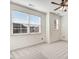 Bedroom with large windows offering bright natural light and neutral carpet at 736 Wickham Ridge Rd, Apex, NC 27539