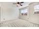 Light-filled bedroom with plush carpeting and a large window at 736 Wickham Ridge Rd, Apex, NC 27539