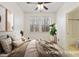 Staged bedroom featuring a large window and attached bathroom at 736 Wickham Ridge Rd, Apex, NC 27539