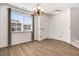 Open-concept dining area bathed in natural light with access to staircase at 736 Wickham Ridge Rd, Apex, NC 27539