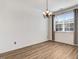 Bright dining room featuring wood-style flooring and elegant chandelier at 736 Wickham Ridge Rd, Apex, NC 27539