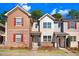 Well-maintained townhomes with inviting curb appeal and manicured landscaping at 736 Wickham Ridge Rd, Apex, NC 27539