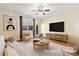 Staged living room featuring natural light, neutral tones, and modern furniture at 736 Wickham Ridge Rd, Apex, NC 27539