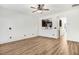 Living room view into kitchen showcasing wood floors, neutral colors, and an open floorplan at 736 Wickham Ridge Rd, Apex, NC 27539