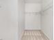 Spacious walk-in closet with carpeted floor and white walls, featuring wire shelving for optimal storage solutions at 736 Wickham Ridge Rd, Apex, NC 27539