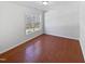Bedroom with hardwood floors and a large window at 8209 Rolling Glenn Dr, Raleigh, NC 27616