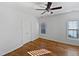 Bedroom with hardwood floors, ceiling fan, and natural light at 8209 Rolling Glenn Dr, Raleigh, NC 27616